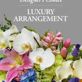 Mixed bouquet with white orchids, pink lilies, and purple flowers