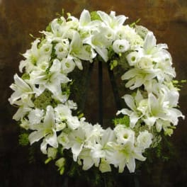 White floral wreath on a stand
