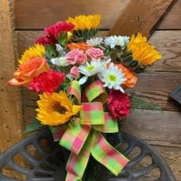 Colorful bouquet of mixed flowers tied with a bright ribbon