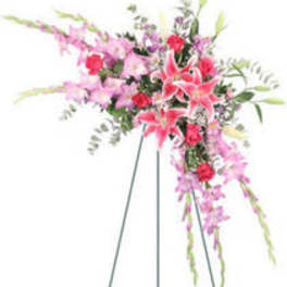 Tall pink floral spray on a stand