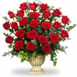 Bouquet of red roses in a decorative urn vase