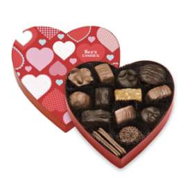 Heart-shaped box of assorted chocolates with a red lid