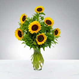 Bouquet of sunflowers in a clear glass vase