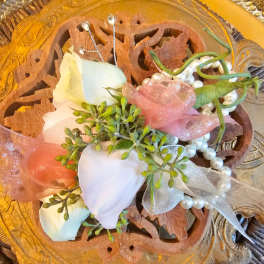 White rose corsage with pink ribbon and pearl accents