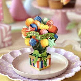 Mini birthday balloon bouquet in a striped gift box