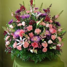 Large mixed bouquet with pink roses, lilies, and purple flowers