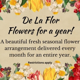 Floral promotional sign with colorful flowers around text