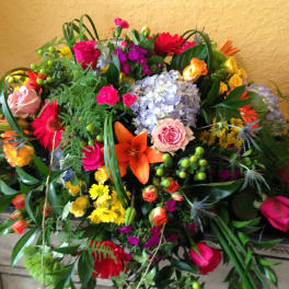 Large mixed bouquet with roses, lilies, hydrangea, and gerbera daisies