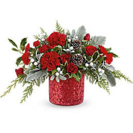 Red roses and carnations in a glittery red vase with pinecones