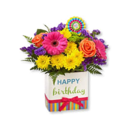 Colorful mixed flower bouquet in a birthday gift box