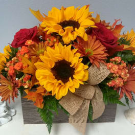 Sunflower and rose arrangement in a rectangular box with burlap ribbon
