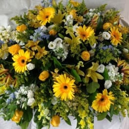 Large yellow and white floral spray with gerbera daisies and roses
