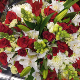 Bouquet of red roses, white lilies, and green snapdragons