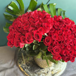 Large bouquet of red roses in a glass vase