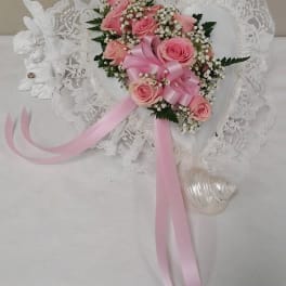 Pink rose bouquet with lace trim and long pink ribbons