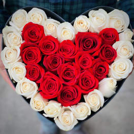Heart-shaped box of red and white roses