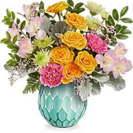 Bouquet of yellow roses, pink carnations, and pale alstroemeria in a turquoise vase