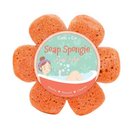 Flower-shaped orange soap sponge with a round label