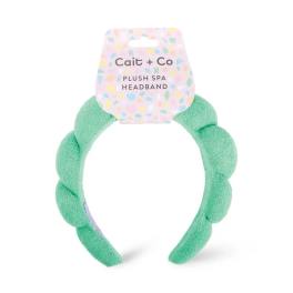 Mint green plush spa headband with a pastel Cait + Co tag