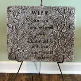 Decorative plaque on a metal stand with the words "WIFE" and a sentimental quote