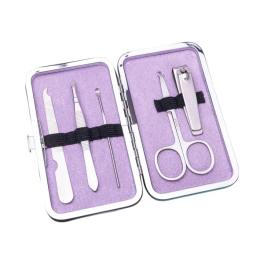Purple manicure kit in an open metal case with nail tools and scissors