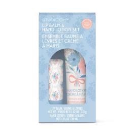 Blue boxed lip balm and hand lotion set with floral packaging