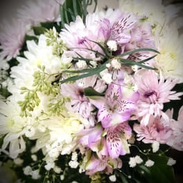 Bouquet of pink and white flowers with small white filler blooms