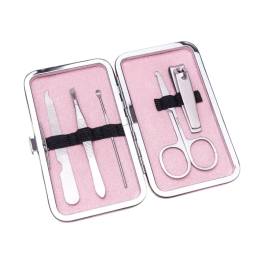 Pink manicure kit in an open metal case with nail tools