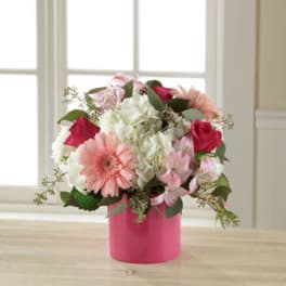 Pink and white mixed bouquet in a bright pink box