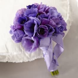 Purple rose bouquet with a lavender ribbon
