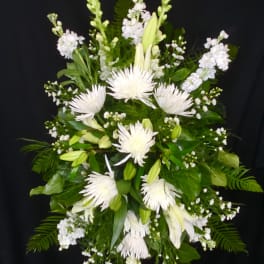 White floral standing spray with lilies and spider mums
