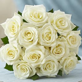 Bouquet of white roses with green leaves