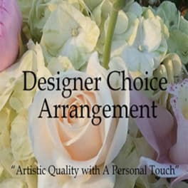 Pastel floral arrangement with a peach rose and pale hydrangeas