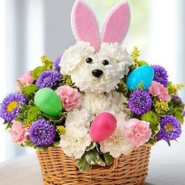 Flower basket with a plush bunny and colorful Easter eggs