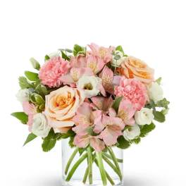 Pink and peach bouquet in a clear glass vase