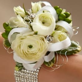White floral wrist corsage with ribbon and rhinestone bracelet