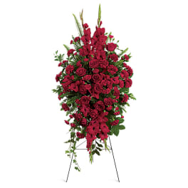 Tall red floral standing spray on an easel