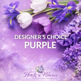 Purple floral arrangement with white tulips and iris on a lavender background