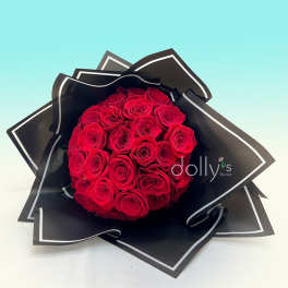 Bouquet of red roses wrapped in black paper