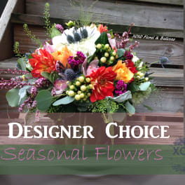 Colorful mixed flower bouquet with a designer choice sign