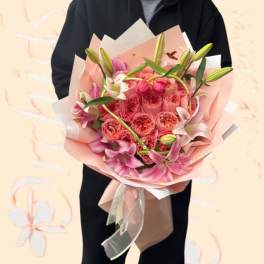 Pink bouquet of roses and lilies wrapped in pastel paper