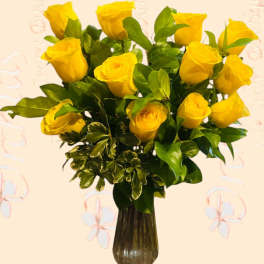 Yellow roses arranged in a dark glass vase