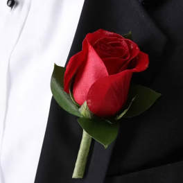 Red rose boutonniere on a black suit jacket