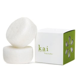 Two white bath bars beside a green-and-white box
