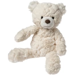 Cream teddy bear plush toy sitting on a white background