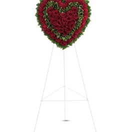 Heart-shaped rose wreath on a standing easel