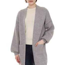 Woman wearing a long gray open-front cardigan over a light top and dark jeans