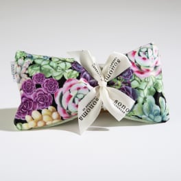 Small rectangular pillow with colorful succulent print and cream bow