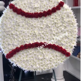 Large white chrysanthemum funeral wreath with red floral bands
