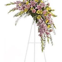 Lavender and yellow floral spray on a standing easel